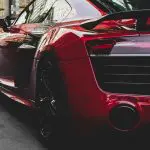 XPEL Paint Protection Film Installation - red sports car parked on the street
