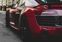 XPEL Paint Protection Film Installation - red sports car parked on the street