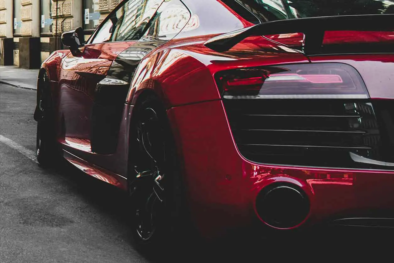 XPEL Paint Protection Film Installation - red sports car parked on the street